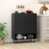 A black sideboard cabinet with two doors and an open shelf below, placed in a kitchen or dining area. Podgląd zdjęcia produktu