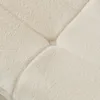 A close-up view of a quilted, textured fabric, likely a sofa or cushion. Produktbild-Vorschau