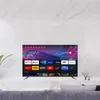 A television displaying a streaming service interface, placed on a stand in a modern living room setting. Anteprima dell’immagine prodotto