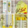 A collage of images showing two thermometers with a vintage theme. One has a Volkswagen design, and the other is a retro-style thermometer with a pin-up girl illustration. Produktbild-Vorschau