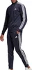 A person wearing an Adidas tracksuit. Produktbild-Vorschau