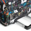 A close-up view of a suitcase with a colorful graffiti-style pattern. Produktbild-Vorschau