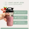 A hand holding a blender cup filled with a pink smoothie, surrounded by strawberries. Text overlays describe the blender's capabilities. Produktbild-Vorschau