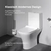 A modern white toilet with a toilet brush holder next to it, set against a gray wall. Produktbild-Vorschau