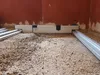 Construction site with gravel and leveling tools. Voir les images du produit
