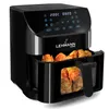 A black air fryer filled with fried chicken. Podgląd zdjęcia produktu