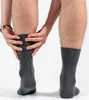 A person is shown putting on a grey sock. Produktbild-Vorschau