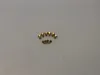 A collection of small brass-colored nozzles arranged in a semi-circle on a light gray background. Produktbild-Vorschau