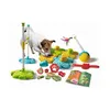 A dog interacting with a collection of dog training toys and treats. Voir les images du produit