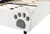 A close-up view of the headboard of a white bed frame with a paw print design. Produktbild-Vorschau