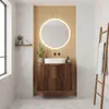 A modern bathroom vanity with a round illuminated mirror above it. Náhled obrázku produktu