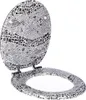 A toilet seat and lid with a mosaic-like pattern of sea creatures and geometric shapes in shades of gray, black, and white, against a white background. Produktbild-Vorschau