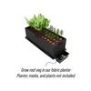 A fabric planter with root vegetables and small plants growing in it, shown on a white background. Produktbild-Vorschau