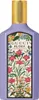 A bottle of Gucci Flora Gorgeous Magnolia Eau De Parfum with a floral design on the label. Produktbild-Vorschau