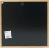 The back of a square wooden picture frame with a black insert and a label attached to the bottom left corner. Náhled obrázku produktu