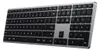 A close-up, angled view of a silver and black wireless keyboard against a light gray background. Podgląd zdjęcia produktu