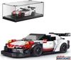 A collage showing a toy sports car model in a display case and a separate, larger view of the same car model. Voir les images du produit