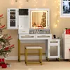A vanity table set up in a room decorated for Christmas, with a Christmas tree and lights. Podgląd zdjęcia produktu