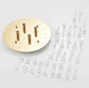 A ceiling light base and crystal pendants are laid out on a white surface. Produktbild-Vorschau