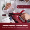 A person is filling a red steam iron with water from a measuring cup. Anteprima dell’immagine prodotto
