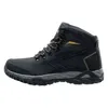 A side view of a black hiking boot with yellow accents. Anteprima dell’immagine prodotto