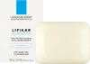 A bar of soap and its packaging are shown against a white background. Podgląd zdjęcia produktu