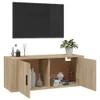 A TV wall unit with a television mounted above it, against a white background. Voir les images du produit