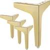 Four gold-colored furniture legs are arranged on a white background. Produktbild-Vorschau