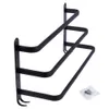 A black metal towel rack mounted on a white background. Voir les images du produit