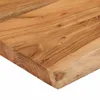 A close-up view of a wooden shelf with a live edge. Náhled obrázku produktu