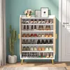 A shoe rack filled with shoes, placed in a room with a teal wall and a cactus plant. Produktbild-Vorschau