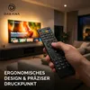 A hand holding a remote control in front of a TV in a living room. Produktbild-Vorschau