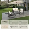 A patio set with a large umbrella on a paved area next to a lawn. Náhled obrázku produktu