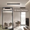 A modern living room with a ceiling light and a smartphone showing a reflection of the room. Voir les images du produit