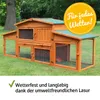 A wooden rabbit hutch with a green roof, set up on a grassy lawn. Produktbild-Vorschau