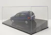 A blue Volkswagen Polo 3 model car is displayed inside a clear plastic case on a black base. Produktbild-Vorschau