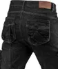 Close-up of the back pockets of black denim jeans. Náhľad obrázku produktu
