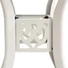 A close-up view of the white metal base of a table, showing decorative scrollwork. Náhled obrázku produktu