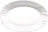 A white oval plate with a wavy rim. Voir les images du produit