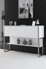 A white console table with silver legs, decorated with three dark vases on the lower shelf, against a black slatted wall. Anteprima dell’immagine prodotto