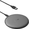 A black wireless charging pad with a USB cable on a white background. Voir les images du produit