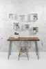 A desk with a chair in front of a wall with shelves. Produktbild-Vorschau