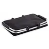 A folded black picnic basket with silver handles and frame, shown on a white background. Produktbild-Vorschau