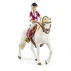 A toy figurine of a girl riding a white horse. Náhľad obrázku produktu