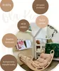 A children's indoor climbing frame with a cushion, set against a neutral background with text overlays highlighting product features. Produktbild-Vorschau
