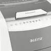 A close-up view of the top section of a white and gray paper shredder, showing control buttons and the 'Automatic' feed slot. Voir les images du produit