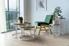 A living room setting with a chair and coffee tables. Produktbild-Vorschau