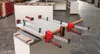 A workbench with a large clamp holding a piece of material. Produktbild-Vorschau