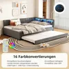 A grey upholstered daybed with a pull-out trundle bed, featuring LED lighting and a remote control. The image is set in a bedroom with decorative wall art. Anteprima dell’immagine prodotto