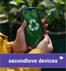 Hands holding a smartphone with a recycling symbol on the screen, with plants in the background. Podgląd zdjęcia produktu